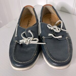 Gently worn Cole Haan boat shoes in navy blue!